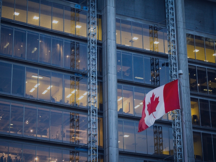 Flag in Front of a Commercial Building in GTA | Moon Tech Electric